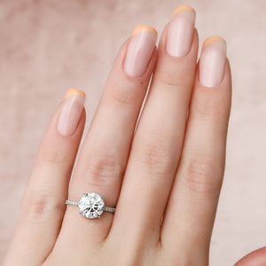 The Pave Aline Set With A Round Lab Diamond