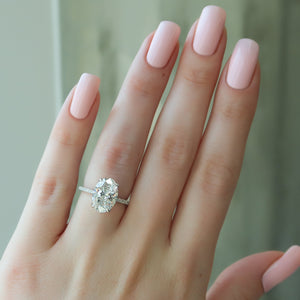 The Pave Nelly Set With A Oval Lab Diamond