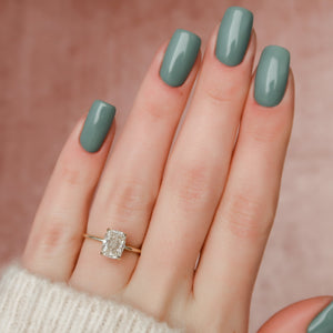 The Crown Kamellie Set With A 2 Carat Elongated Cushion Moissanite