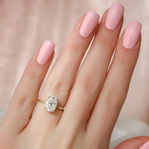 The Crown Kamellie Set With A 1.5 Carat Oval Lab Diamond