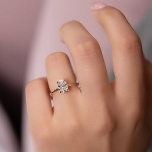 The Crown Kamellie Set With A 1.5 Carat Oval Lab Diamond