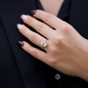 The Crown Kamellie Set With A 1.5 Carat Oval Lab Diamond