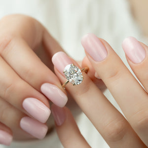 The Crown Kamellie Set With A 1.5 Carat Oval Lab Diamond