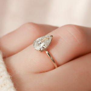 The Crown Kamellie Set With A 1.5 Carat Pear Lab Diamond