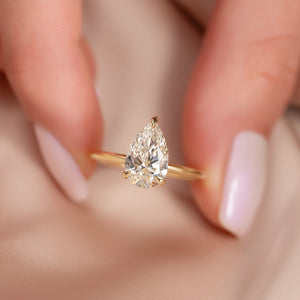 The Crown Kamellie Set With A 1.5 Carat Pear Lab Diamond