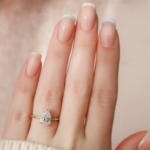 The Crown Kamellie Set With A 1.5 Carat Pear Lab Diamond