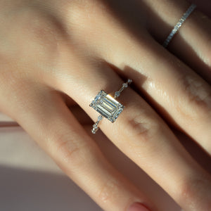 The Hidden Halo Penelope Set With A 1 Carat Emerald Moissanite