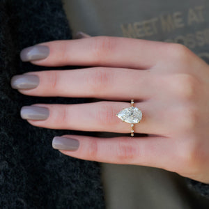 The Hidden Halo Penelope Set With A 5 Carat Pear Moissanite