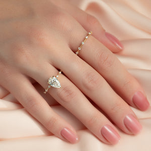 The Hidden Halo Penelope Set With A 5 Carat Pear Moissanite