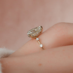 The Hidden Halo Penelope Set With A 5 Carat Pear Moissanite