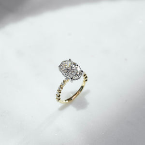 The Khloe Set With A 1.5 Carat Oval Lab Diamond