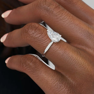 The Razor Kamellie Set With A 1.5 Carat Pear Moissanite