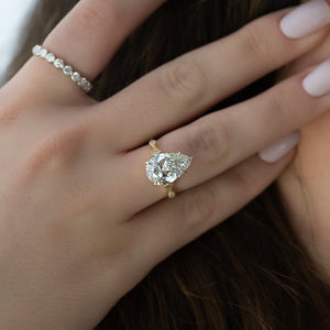 The Amber Set With A 4 Carat Pear Moissanite