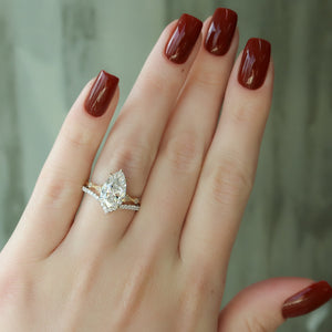 The Amber Set With A 4 Carat Pear Moissanite