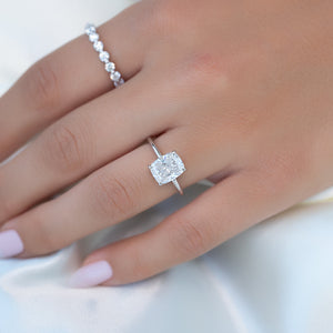 The Low Profile Kamellie Set With A 2 Carat Elongated Cushion Moissanite