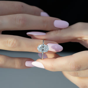 The Low Profile Kamellie Set With A 1.5 Carat Oval Lab Diamond