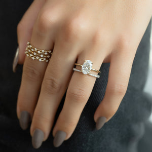 The Low Profile Kamellie Set With A 1.5 Carat Oval Lab Diamond