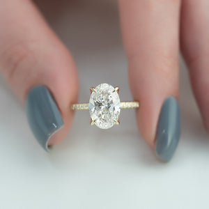 The Pave Petal Kamellie Set With A Oval Lab Diamond