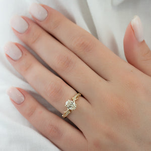 The Pave Twig Set With A 1.5 Carat Oval Lab Diamond
