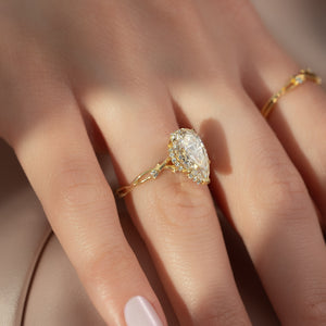 The Halo Twig Set With A 4 Carat Pear Moissanite