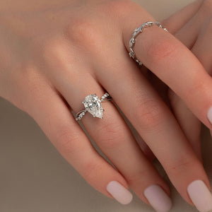 The Daisy Set With A 1.5 Carat Pear Moissanite