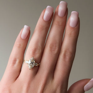The Three Stone Twig Set With A 1.5 Carat Marquise Lab Diamond