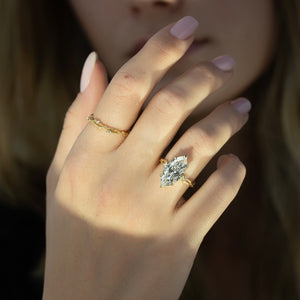 The Textured Twig Set With A 1.5 Carat Marquise Lab Diamond