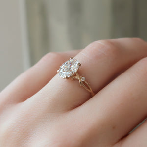 The Textured Twig Set With A Oval Moissanite