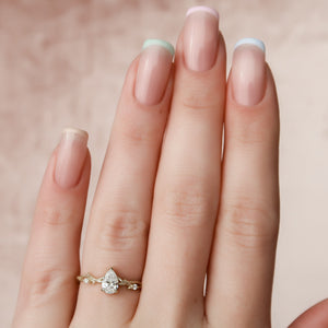 The Textured Twig Set With A Pear Lab Diamond